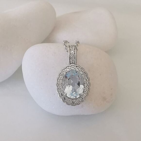 Diamond halo around Sky Blue Topaz pendant necklace - Picture 5 of 9
